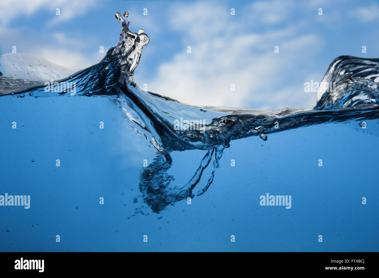 Water and air bubbles over sky background. Stock Photo