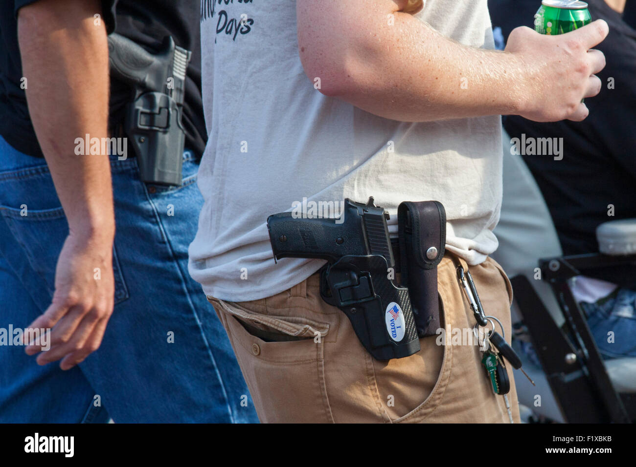 Detroit, Michigan - Members of the Ironworkers union openly carry hand guns during Detroit's Labor Day parade. Stock Photo
