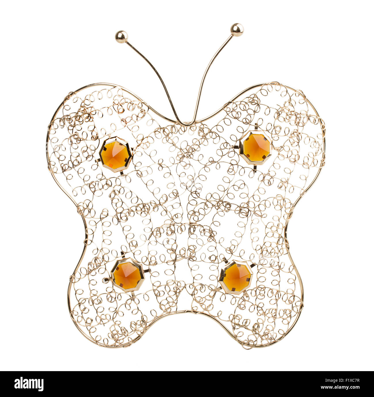 gold filigree butterfly on a white background. Stock Photo