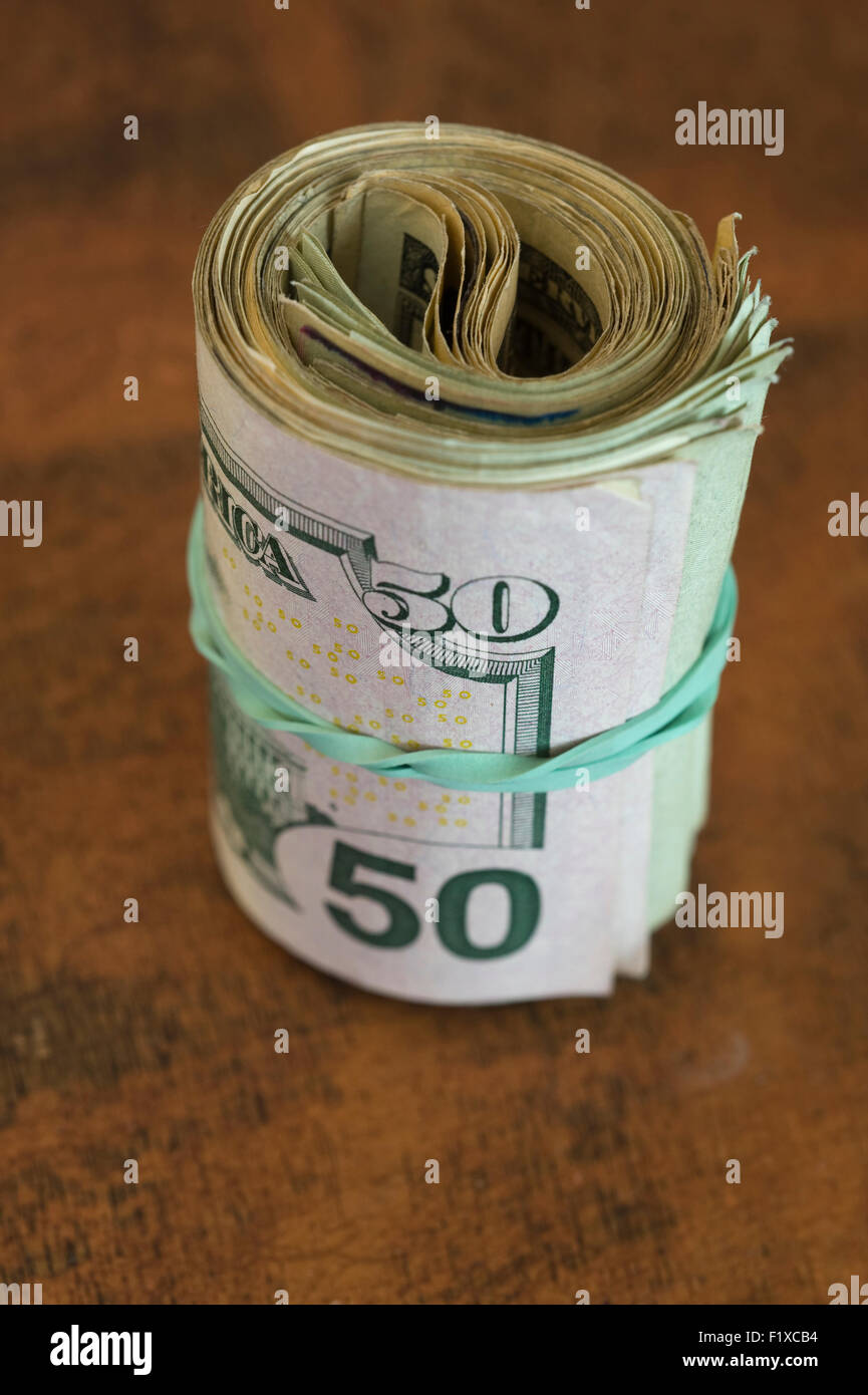 Money Roll of USA currency held with a rubber band Stock Photo Alamy