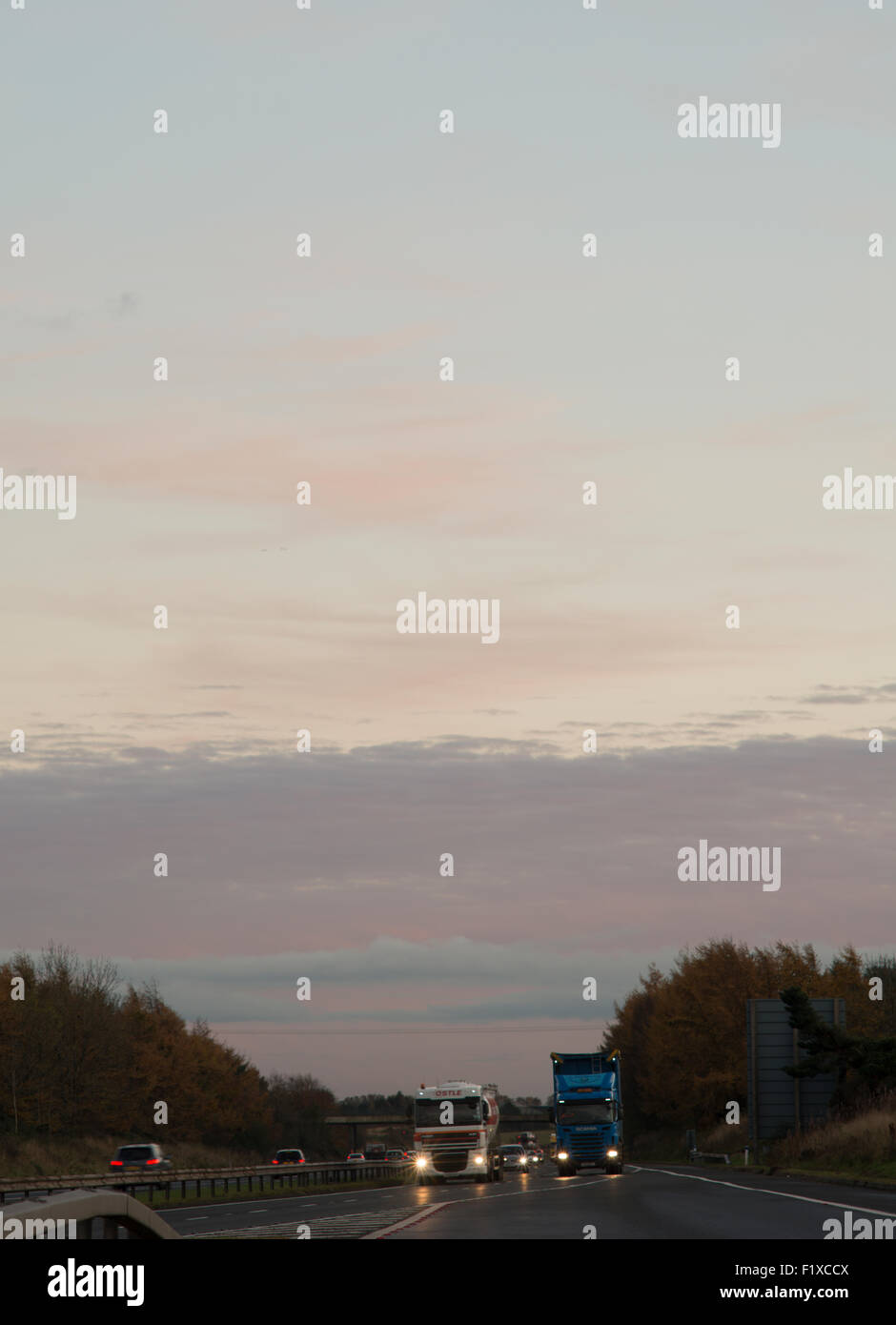 Lorries on motorway at night uk hi-res stock photography and images - Alamy