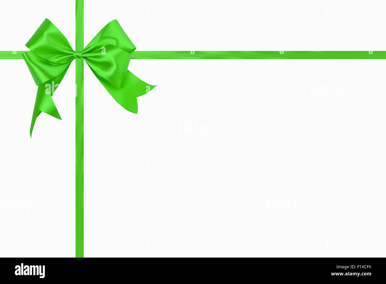 Green bow with a ribbon on a white background. Stock Photo