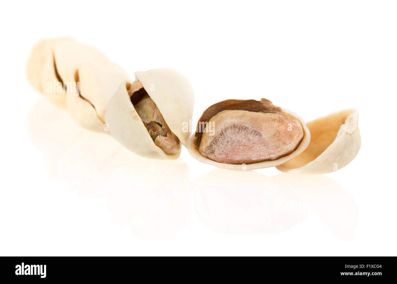 Pistachio nuts, fruits isolated on white background. Stock Photo