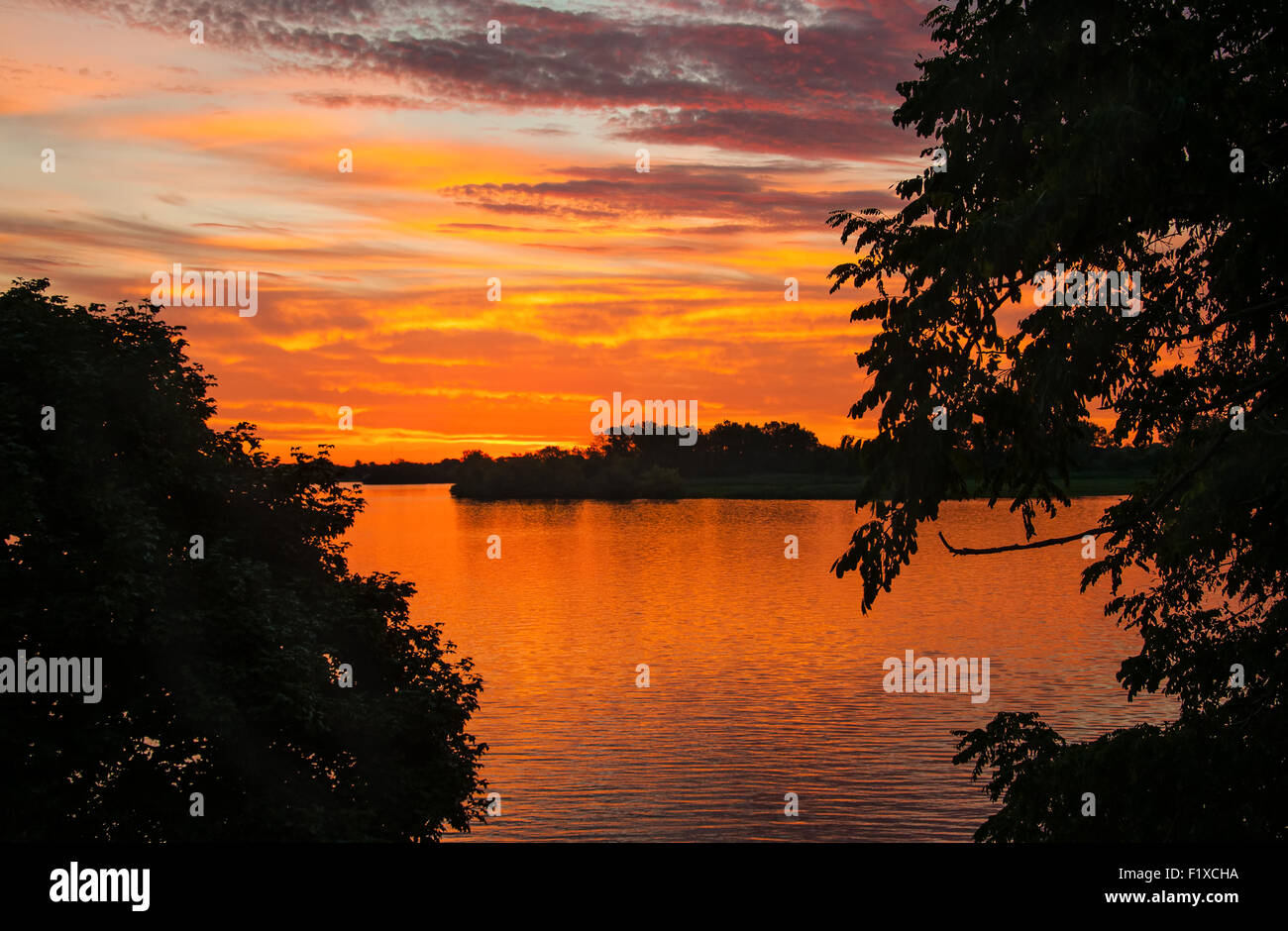 Silhouette of sunrise on detroit river south Stock Photo - Alamy