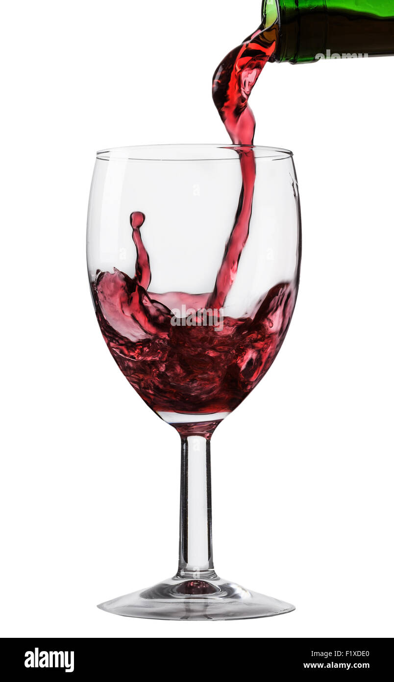 pouring wine into a glass on a white background. Stock Photo