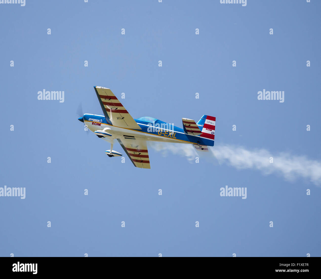 "Little and Large" a full-size and model aircraft performing formation aerobatics at the 2015 Shoreham airshow This is the model Stock Photo