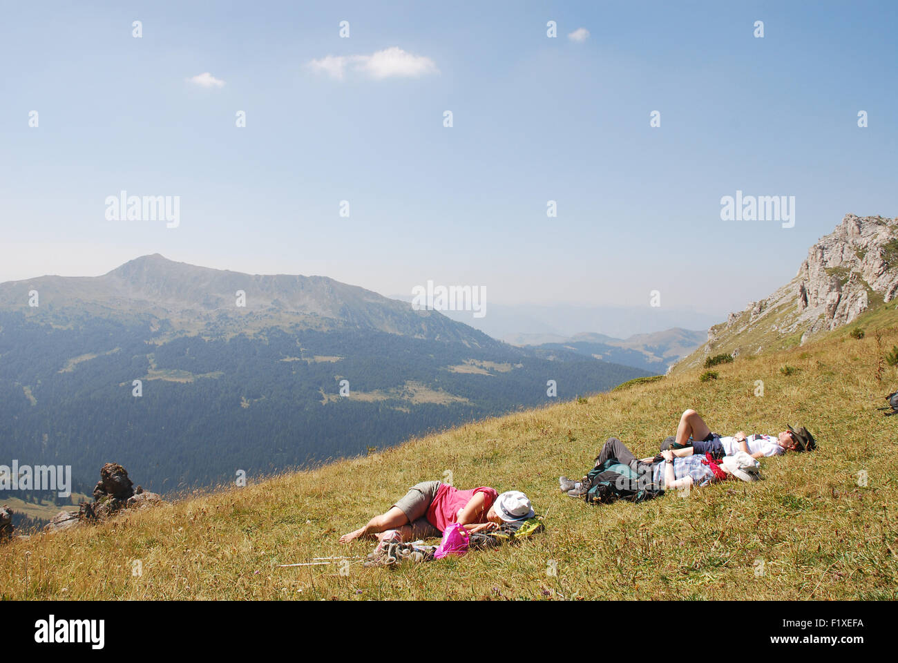 Trekkers rests at the top of the Jelenak pass at the Albanian Montenegro boarder in the Balkans Stock Photo