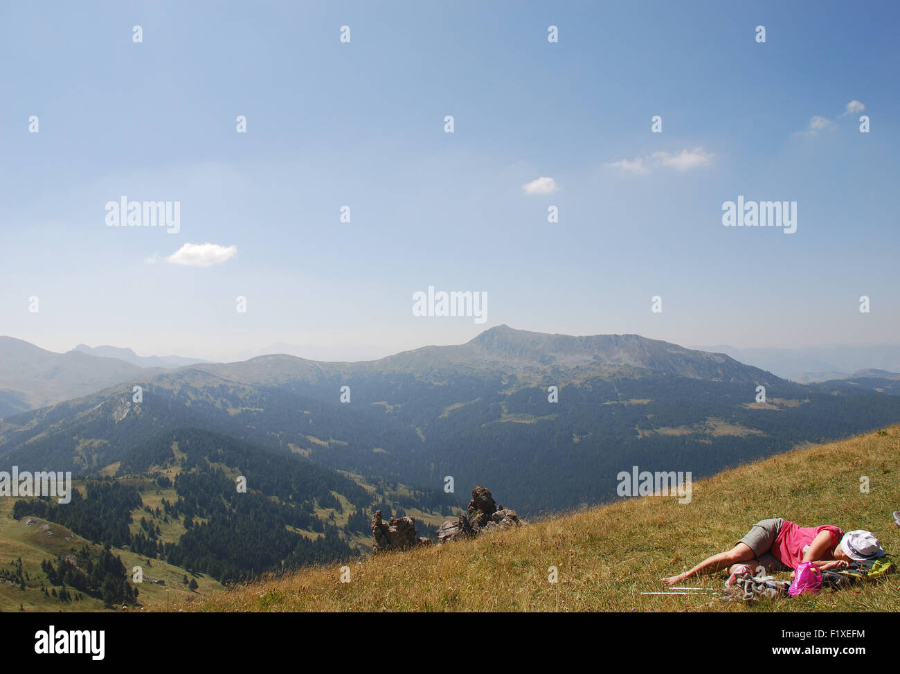 A trekker rests at the top of the Jelenak pass at the Albanian Montenegro boarder in the Balkans Stock Photo