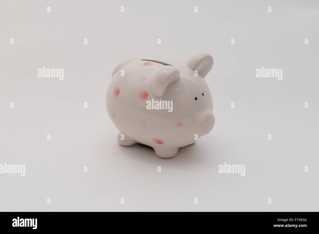 Simple white piggy bank for savings Stock Photo