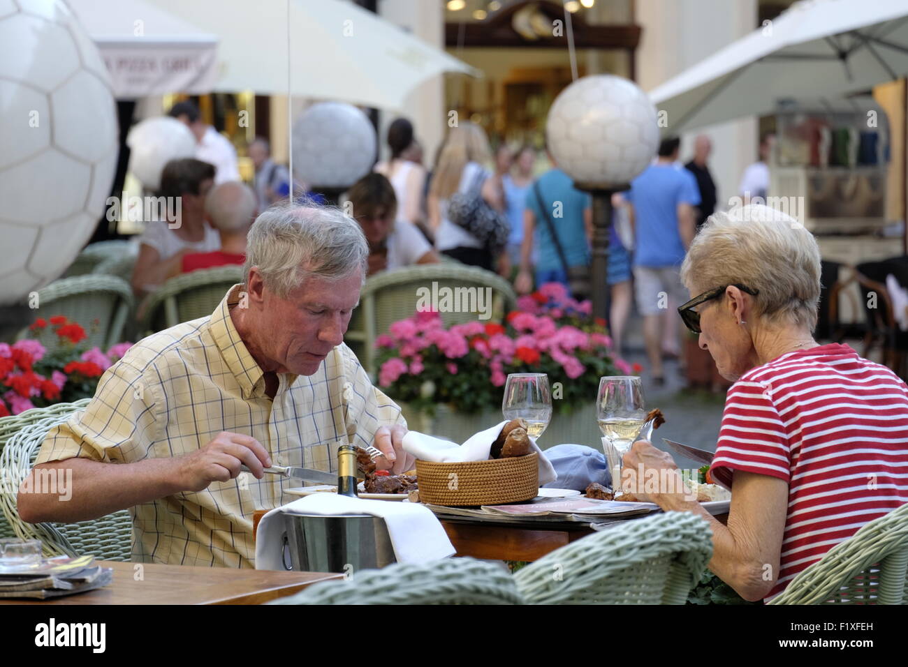 Older people eating at an outdoor restaurant in Prague, Czech Republic, Europe Stock Photo