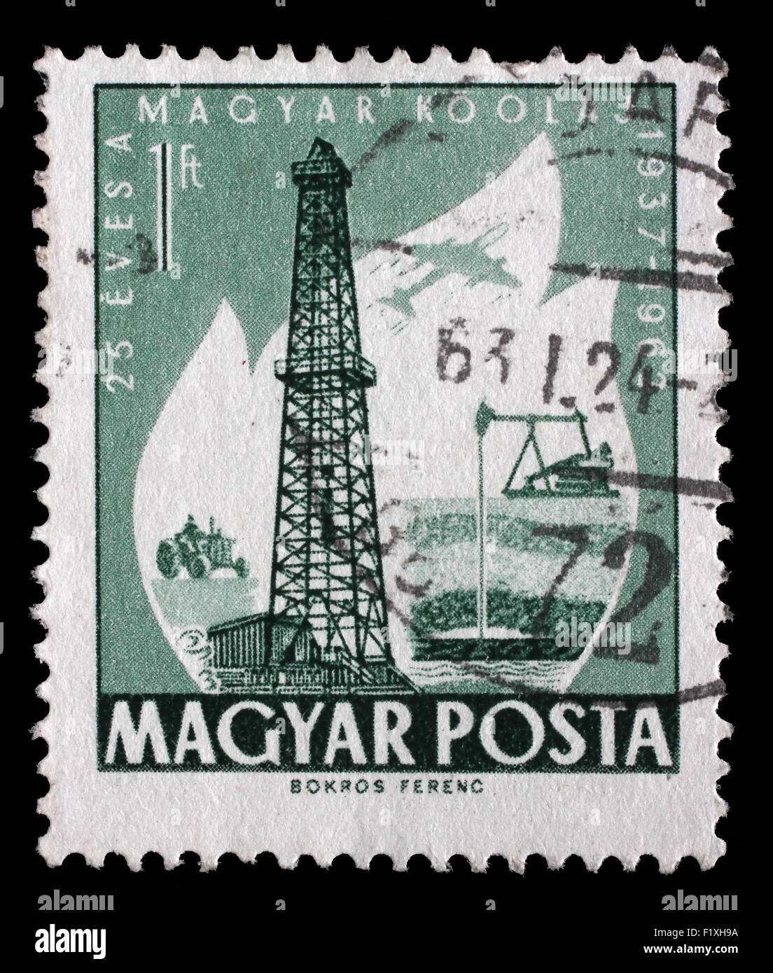 Stamp printed in Hungary dedicated to 25 anniversary of the exploitation of oil, shows Primitive and Modern Oil wells,circa 1962 Stock Photo