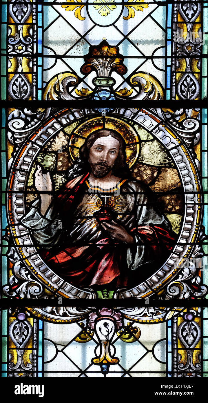 Sacred heart of Jesus, stained glass window in Cathedral of St Nicholas in Novo Mesto, Slovenia on June 30, 2015 Stock Photo
