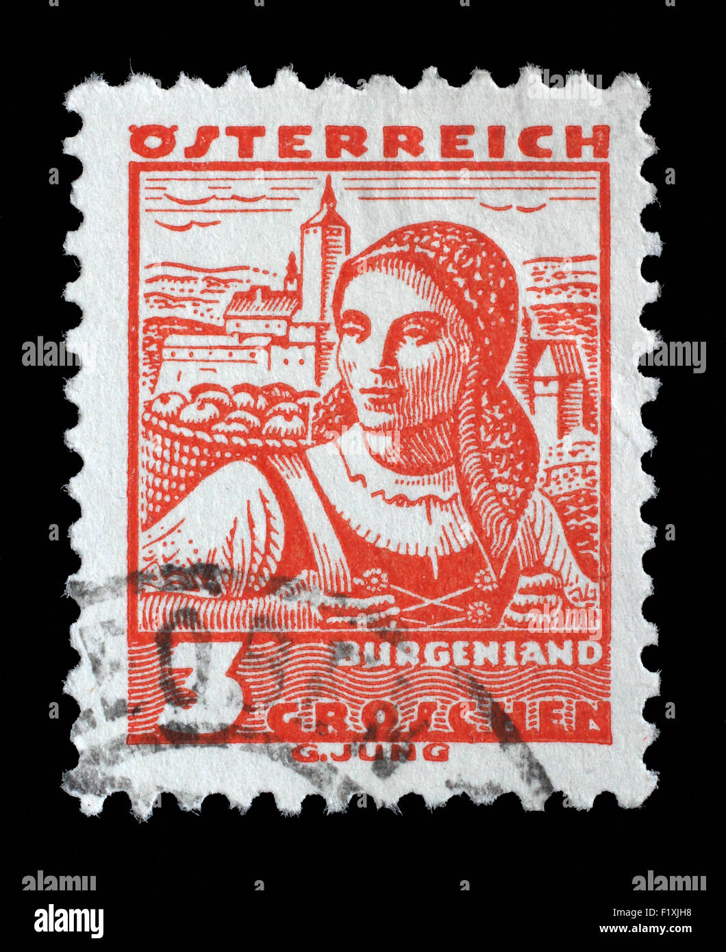 Stamp printed in Austria shows a woman in the Austrian national dress with the inscription 'Burgenland', circa 1934 Stock Photo