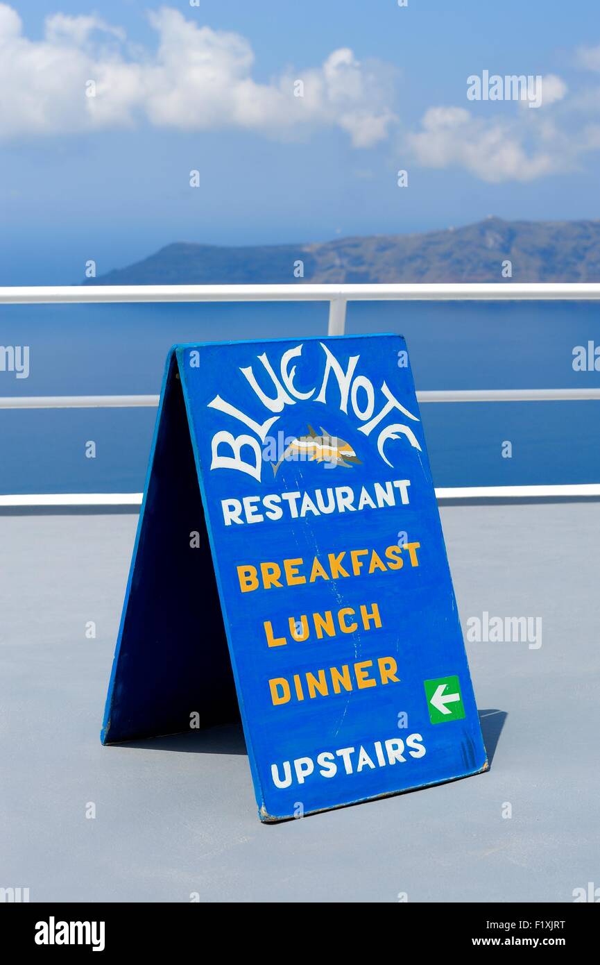 Blue note restaurant sign on a caldera roof top Santorini Greece Stock Photo