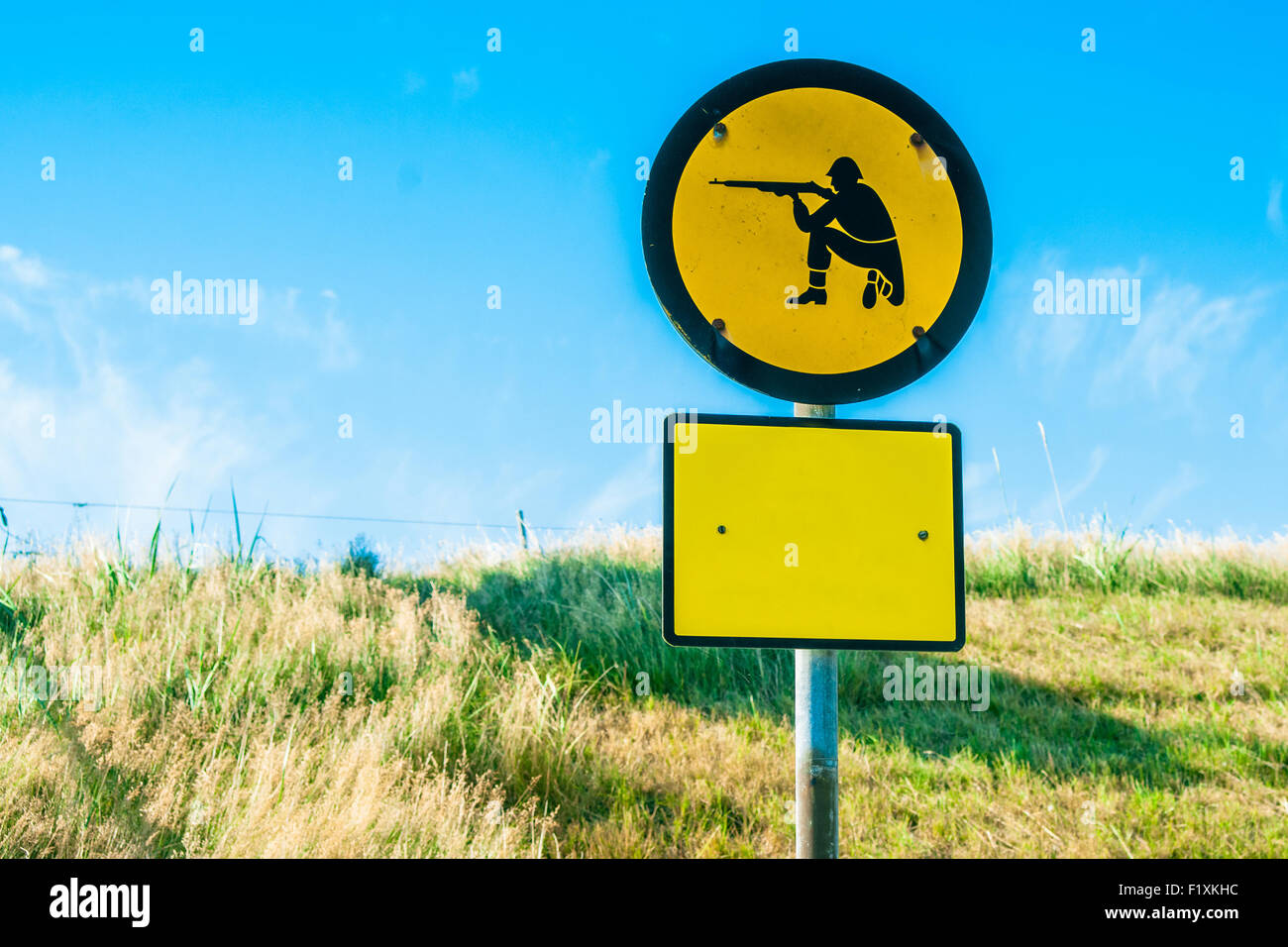 Shooting range sign in yellow color on a field Stock Photo