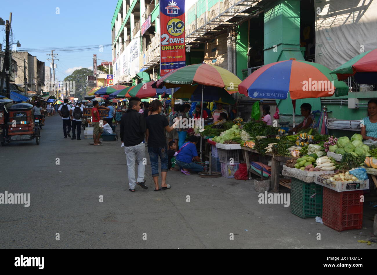 The market place inTugeogharo the northern most state of thePhilippines Streets stalls sellingfresh vegetables to nick nacks Stock Photo