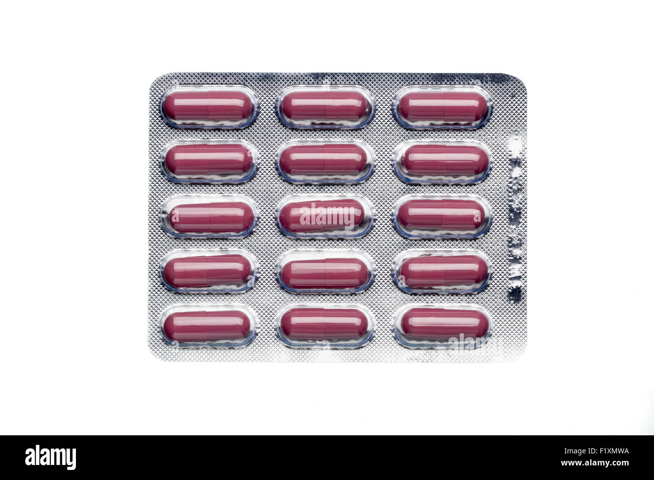 Brown capsules in a blister pack isolated on white background Stock