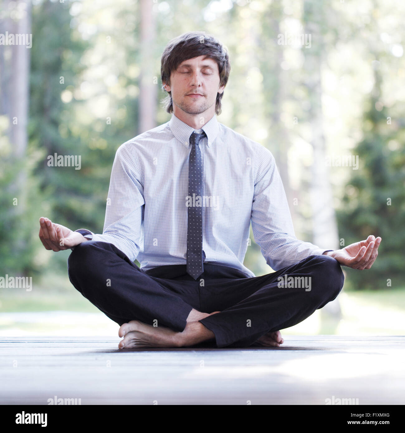 businessman doing yoga Stock Photo - Alamy