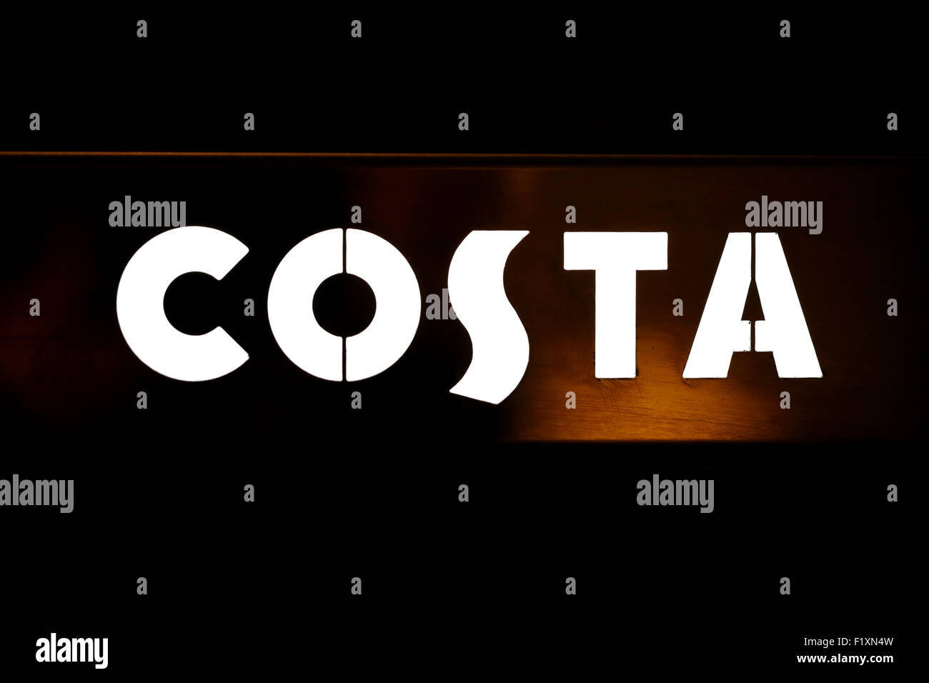 The Costa coffee company logo illuminated inside one of the coffee shops chain of premises Stock Photo