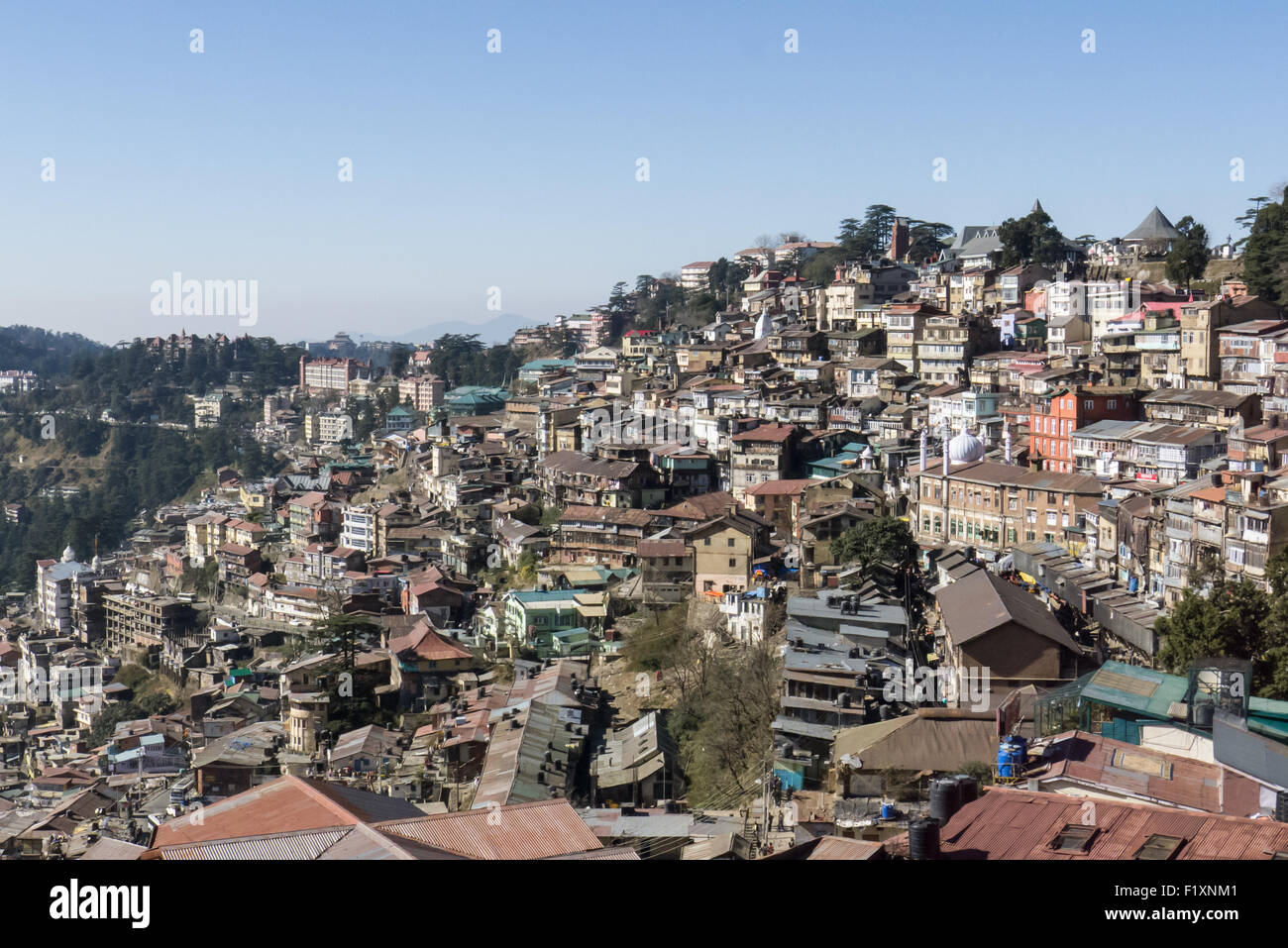 Shimla, Himachal Pradesh, India. View of the jumble of buildings cascading down the hillside which form the centre of the city. Stock Photo