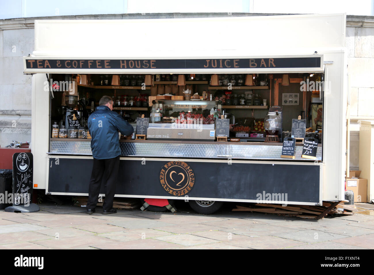 A man being served at a coffee stop on the south bank in london. The coffee house is a recommended coffee shop in London Stock Photo