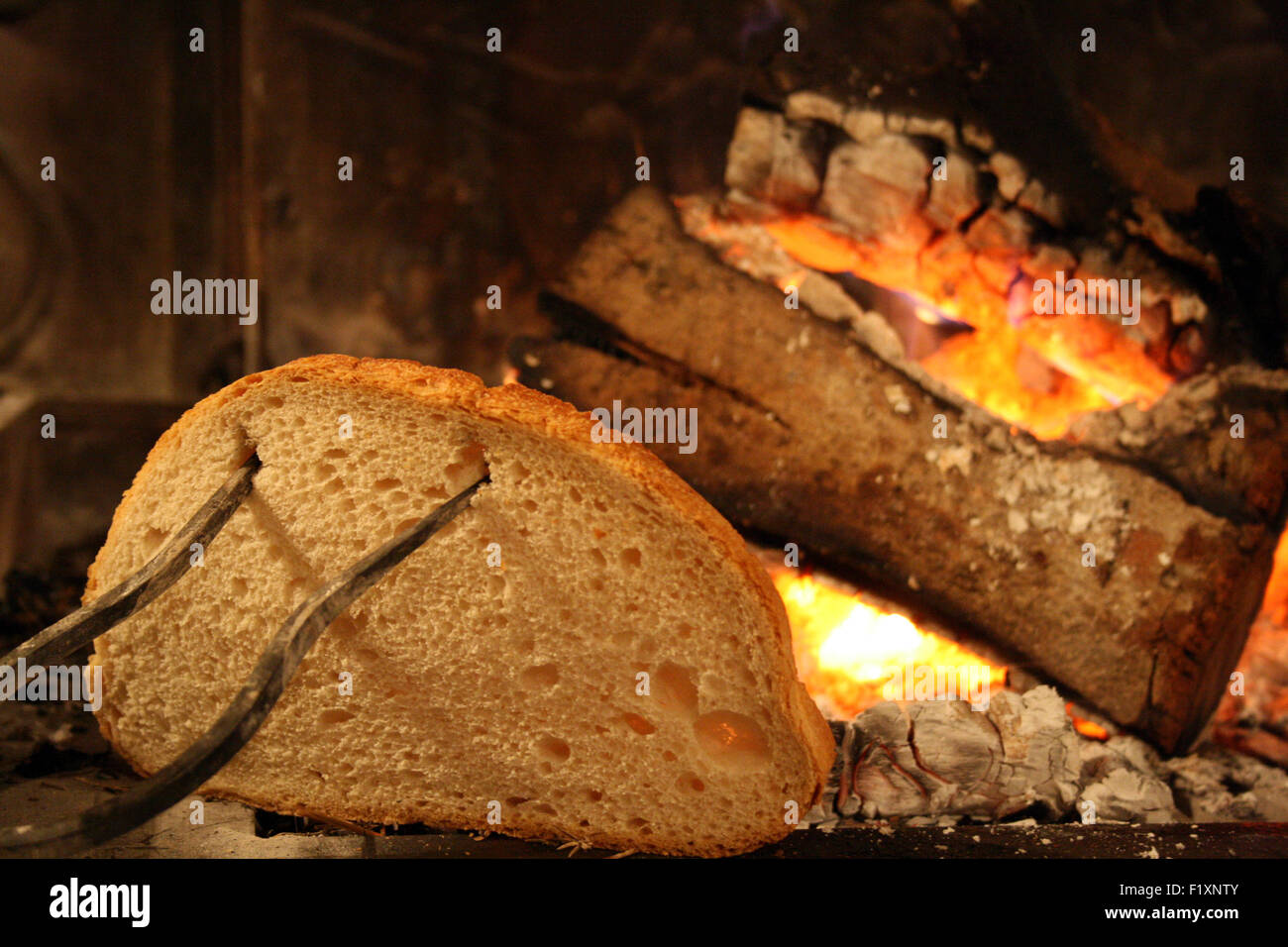Toasting bread at fire Stock Photo Alamy