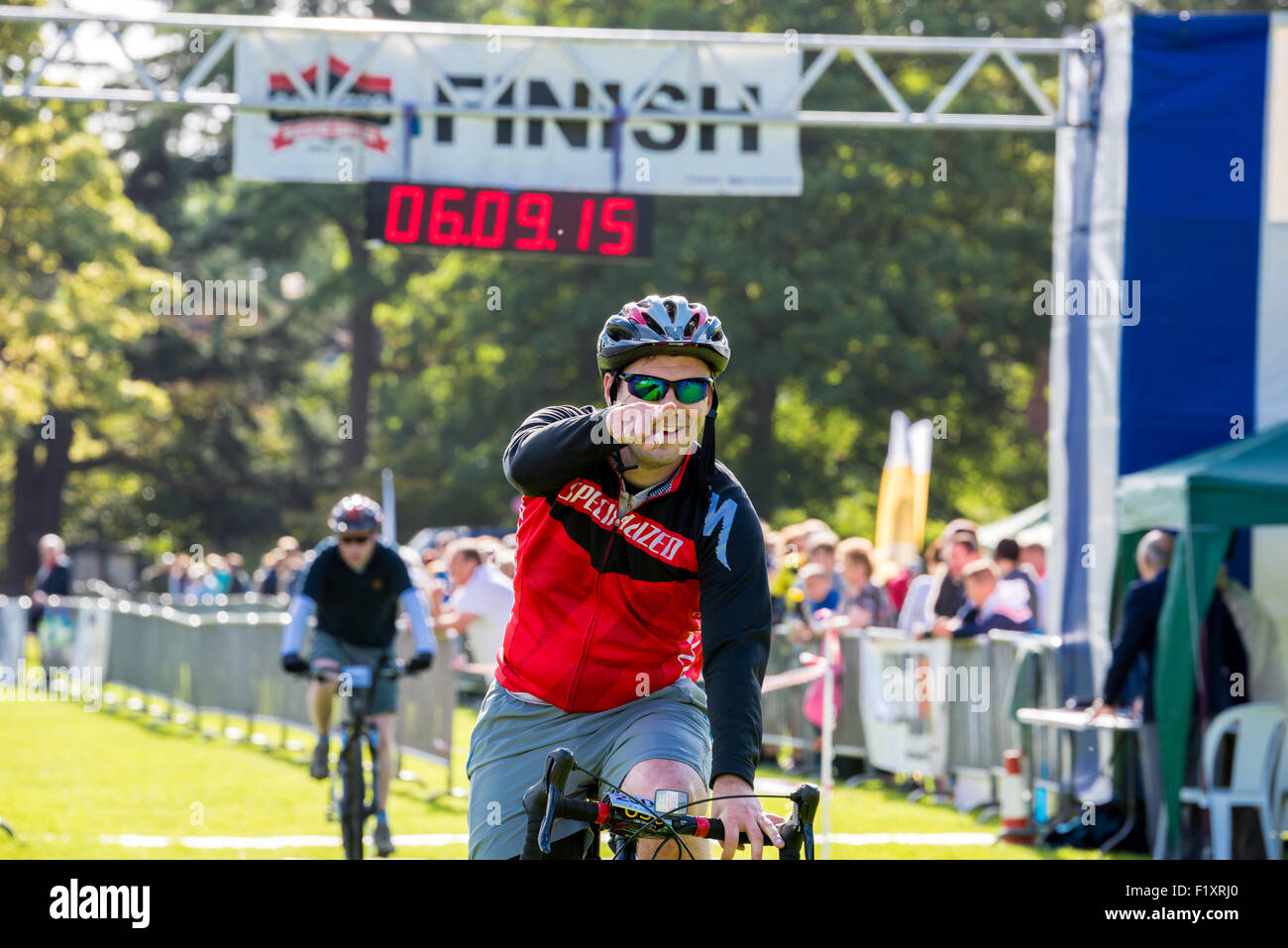 Cyclists finishing the 20k bike ride at The Carvers sponsored Wolverhampton Marathon 2015 UK Stock Photo