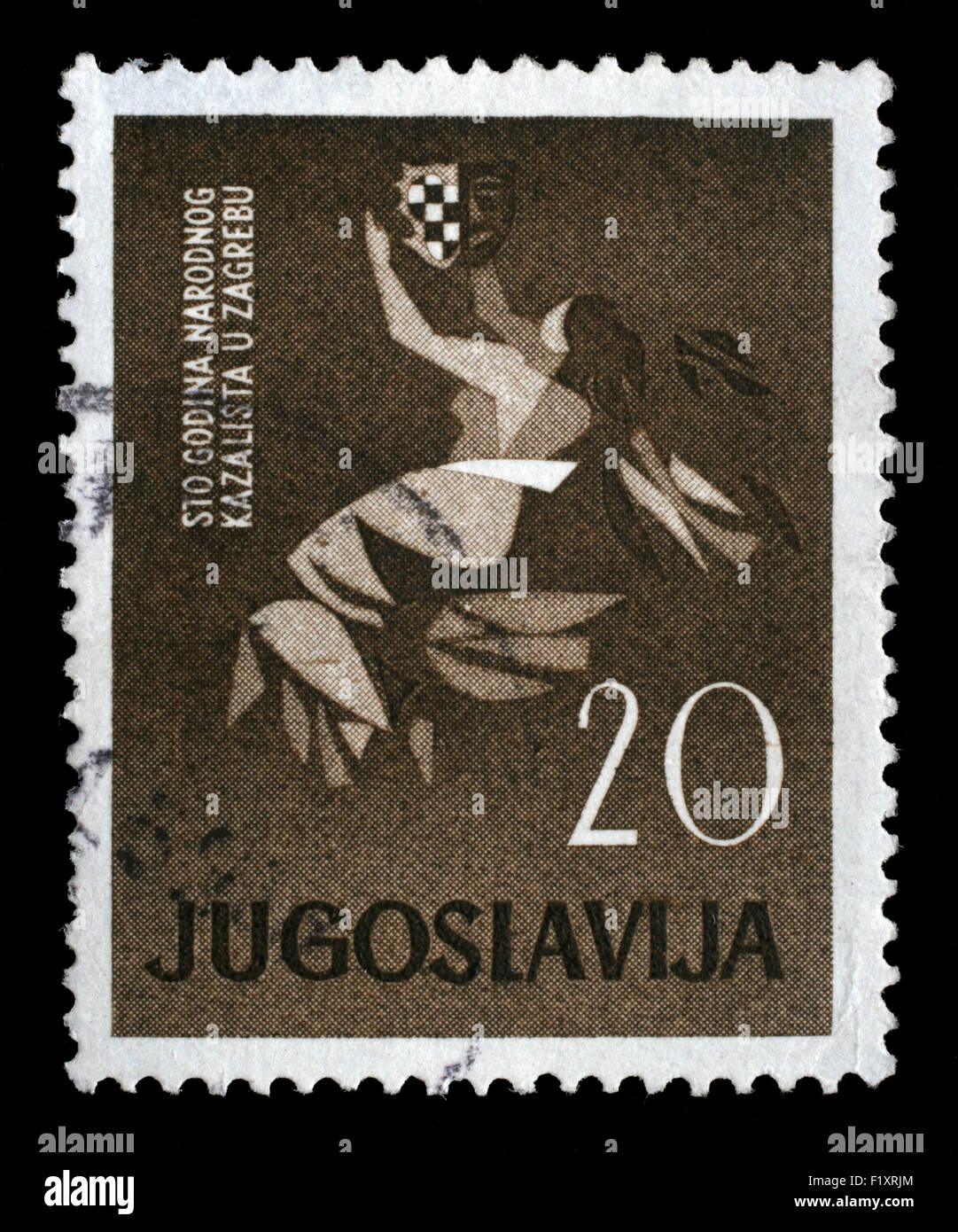 Stamp printed in Yugoslavia dedicated to 100 anniversary of the Croatian National Theater in Zagreb, circa 1960. Stock Photo