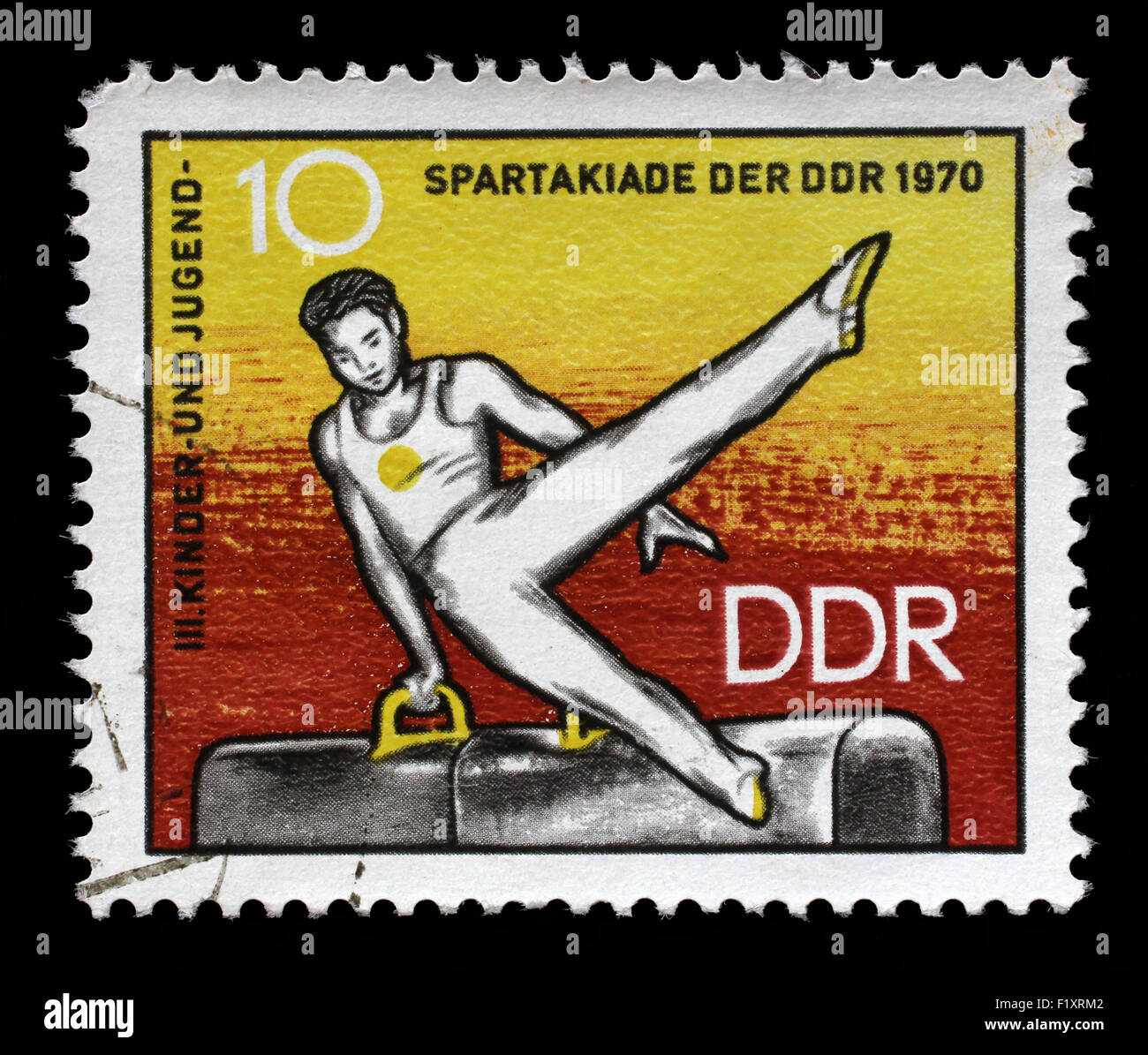 Stamp printed in GDR shows Athlete on Pommel Horse, 3rd Childrens' and Youths' Spartakiad, circa 1970 Stock Photo