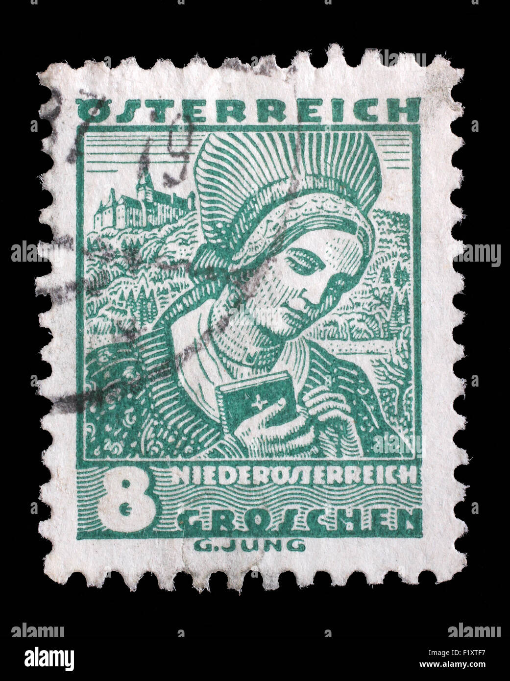 Stamp printed by AUSTRIA shows Woman from Lower Austria (Niederosterreich), Traditional folk costume, circa 1934. Stock Photo