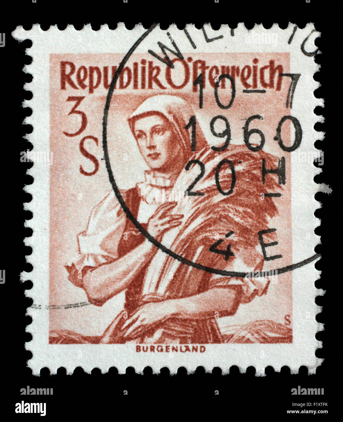 AUSTRIA - CIRCA 1949: A stamp printed in Austria shows image woman in national Austrian costumes, Burgenland, series, circa 1949 Stock Photo