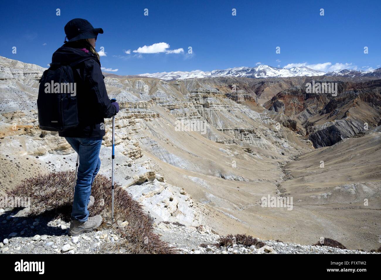 Nepal, Gandaki zone, Upper Mustang (near the border with Tibet), trekker and mineral landscape between Lo Manthang and the village of Dhie Gaon Stock Photo