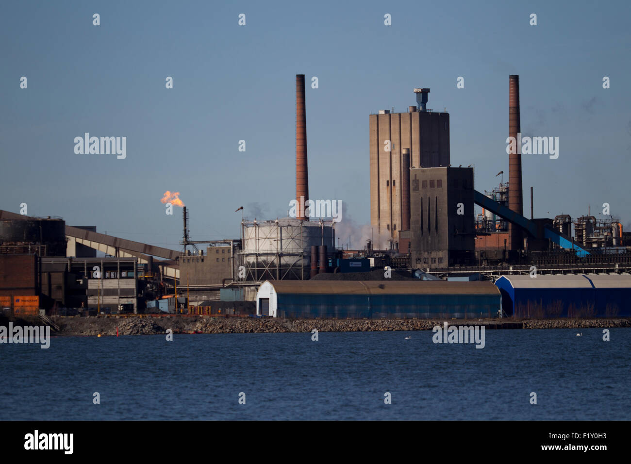 View of a Swedish steel mills with smoking chimneys Stock Photo