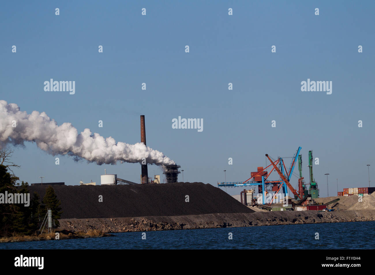 View of a Swedish steel mills with smoking chimneys Stock Photo