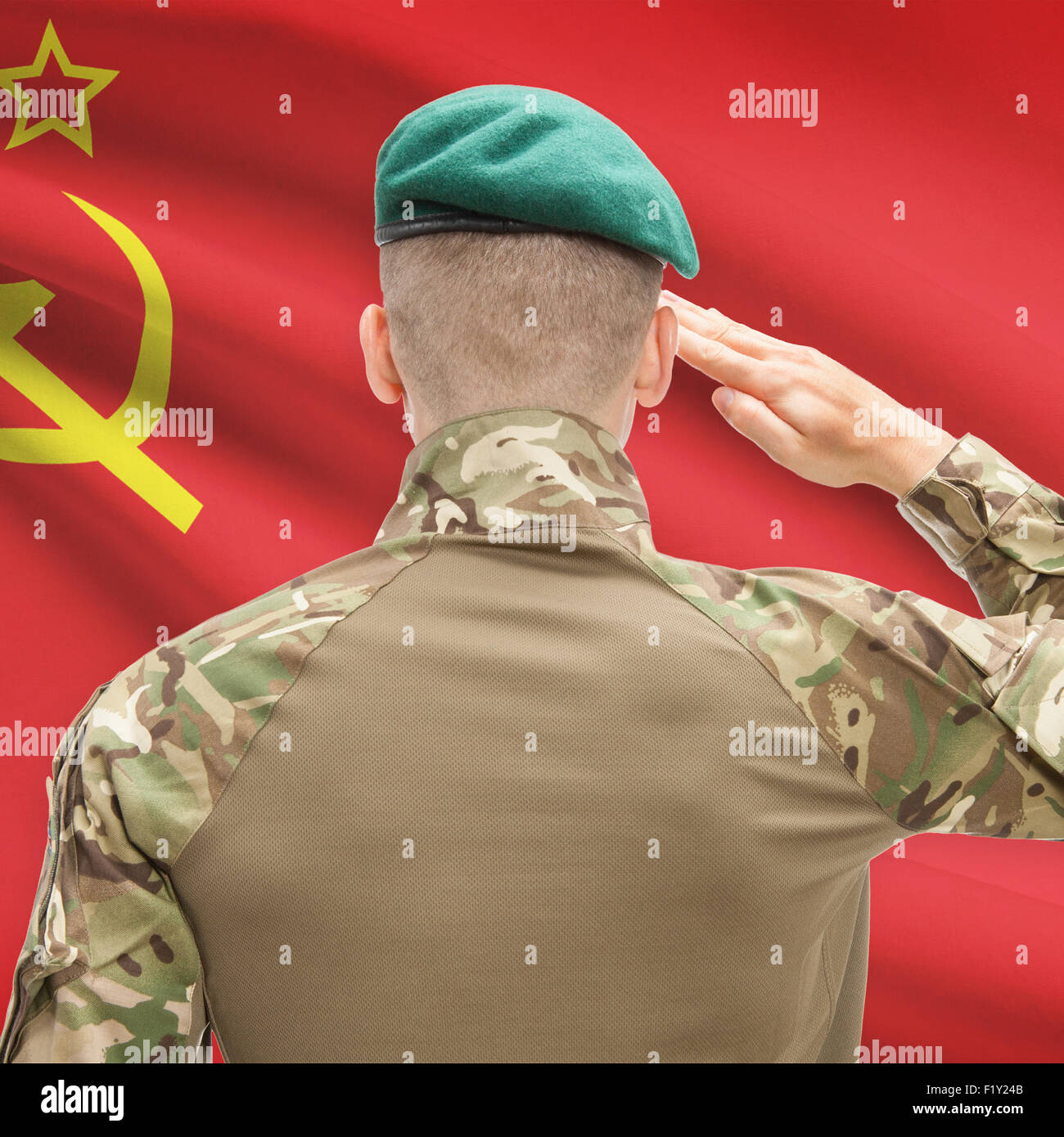 Soldier in hat facing national flag series - USSR - Soviet Union Stock Photo
