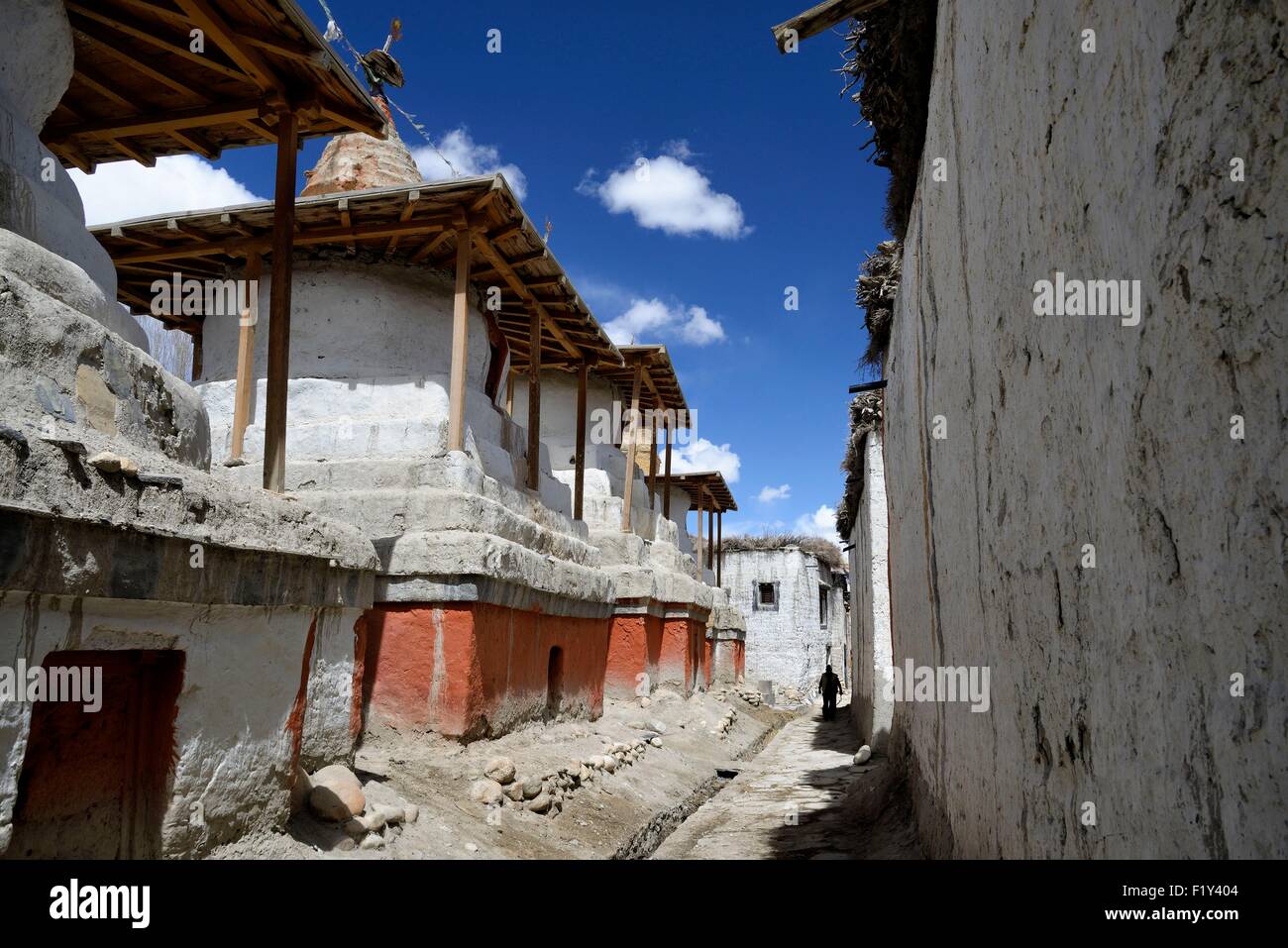 Nepal, Gandaki zone, Upper Mustang (near the border with Tibet), silhouette of a man in a street with stupa (chorten) in the walled city of Lo Manthang, the historical capital of the Kingdom of Lo Stock Photo