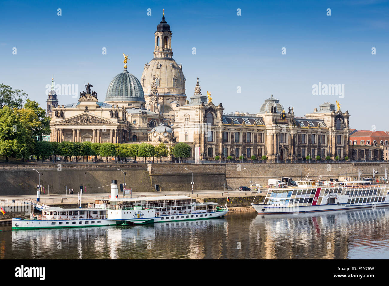 Saxony, Dresden, The city skyline with cruise boats moored on the River Elbe in front of the embankment buildings Stock Photo