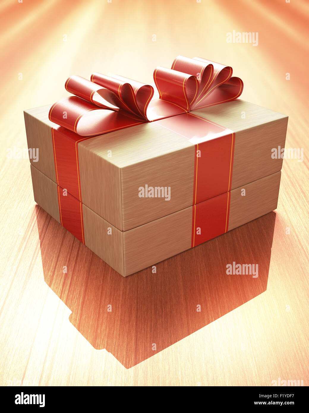 Gift with red ribbon tied up, on a wooden table. Clipping path included. Stock Photo