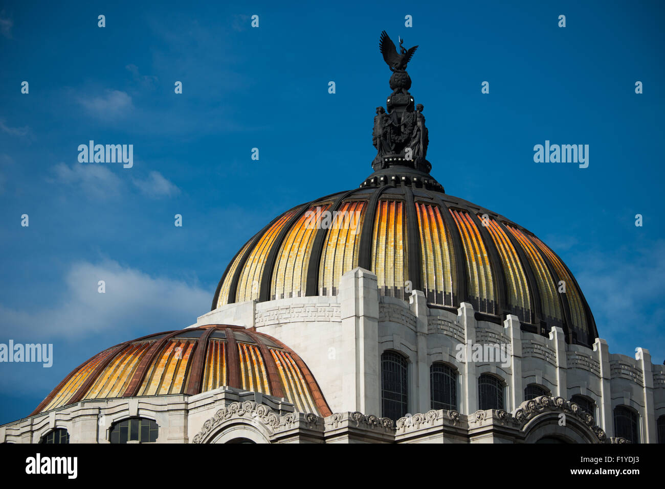 MEXICO CITY, Mexico — The Palacio de Bellas Artes (Palace of Fine Arts) is Mexico's most important cultural center. It's located on the end of Alameda Central park close to the Zocalo in Centro Historico. The building was completed in 1934 and features a distinctive tiled roof on the domes. Stock Photo