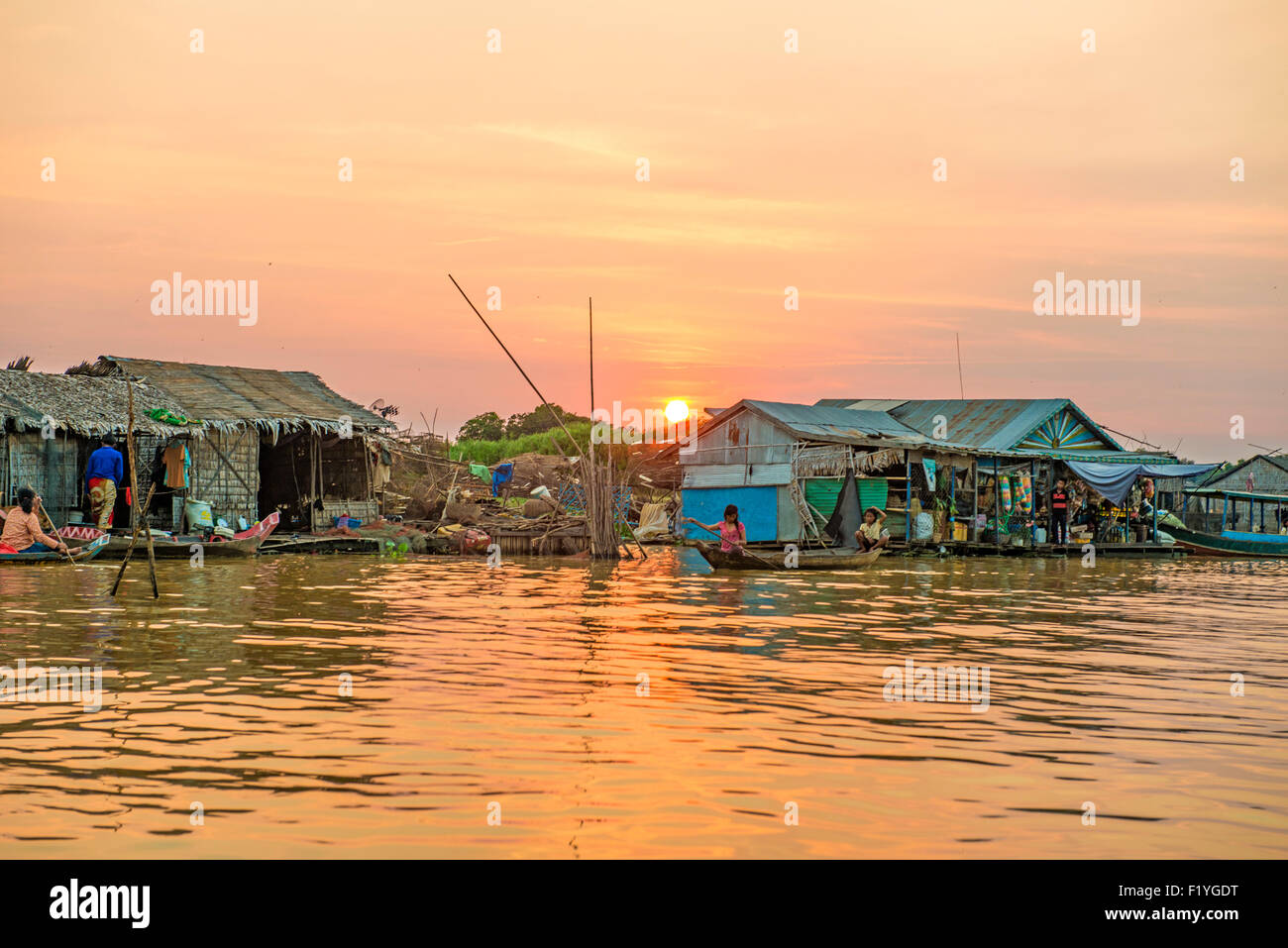 woman on a boat in the floating village near Kompong Chnang in Cambodia Stock Photo