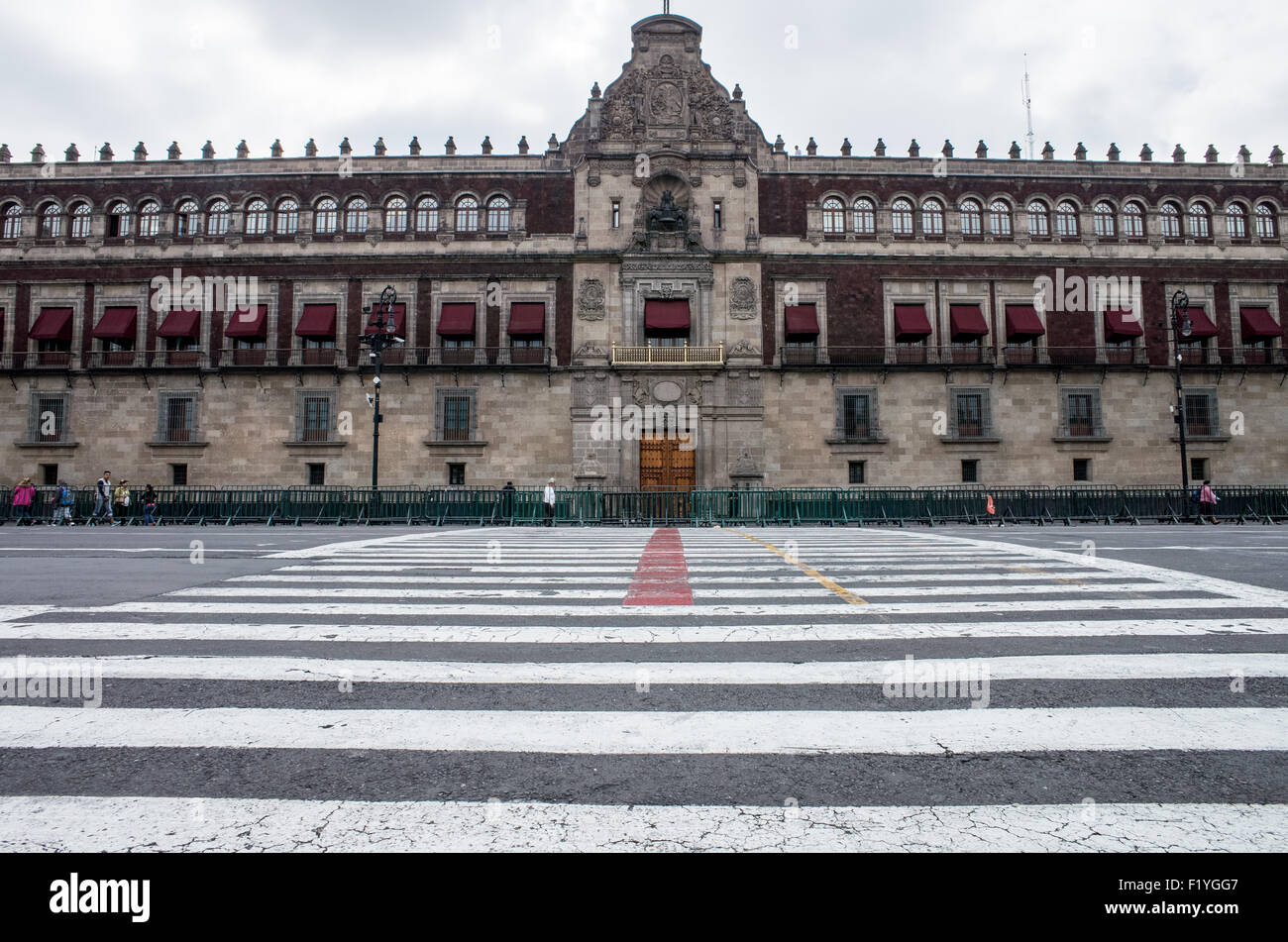The Palacio Nacional (National Palace), the building housing the executive branch of the Mexican government. Formally known as Plaza de la Constitución, the Zocalo is the historic heart of Mexico City. Stock Photo