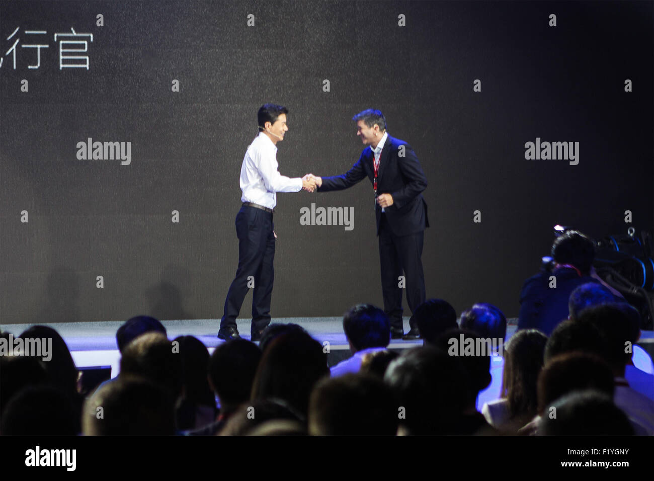 Beijing, China. 8th Sep, 2015. Baidu's CEO Robin Li Yanhong (L) shakes ...