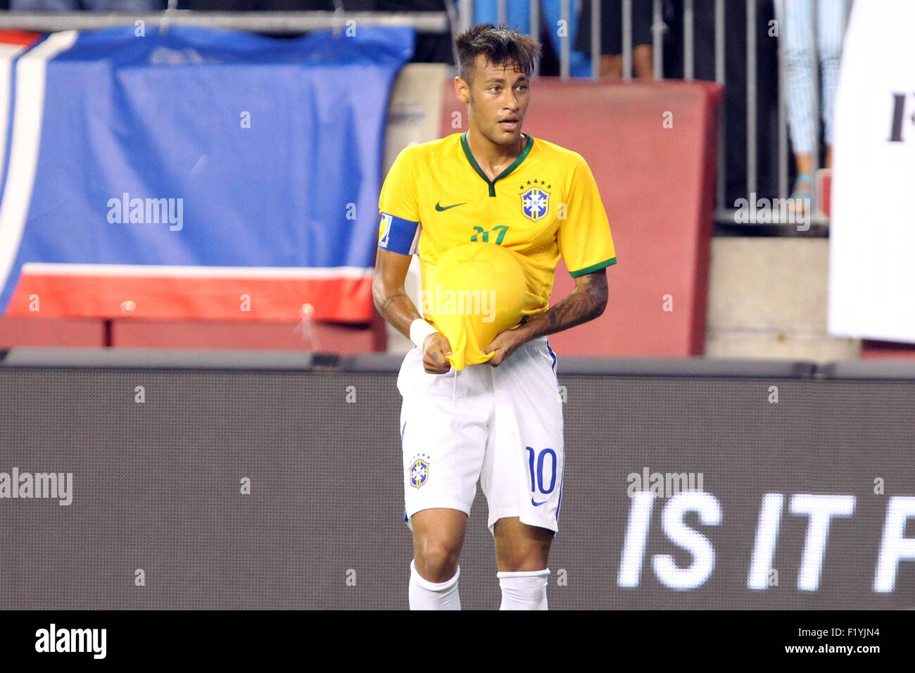Foxborough, Massachusetts, USA. 8th Sep, 2015. Brazil forward Neymar (10) puts the ball under his jersey after scoring a goal in the second half of the Brazil and USA international friendly match at Gillette Stadium. Brazil defeated USA 4-1. Anthony Nesmith/Cal Sport Media Stock Photo