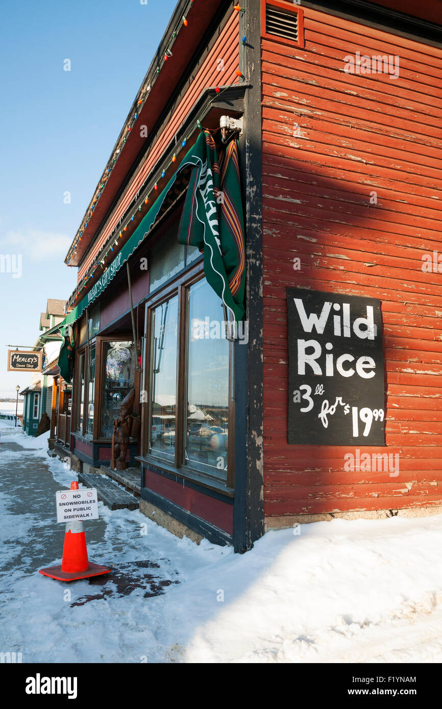 Corner of building with sign warning snowmobiles to stay off the sidewalk in winter, Ely, MN, USA Stock Photo