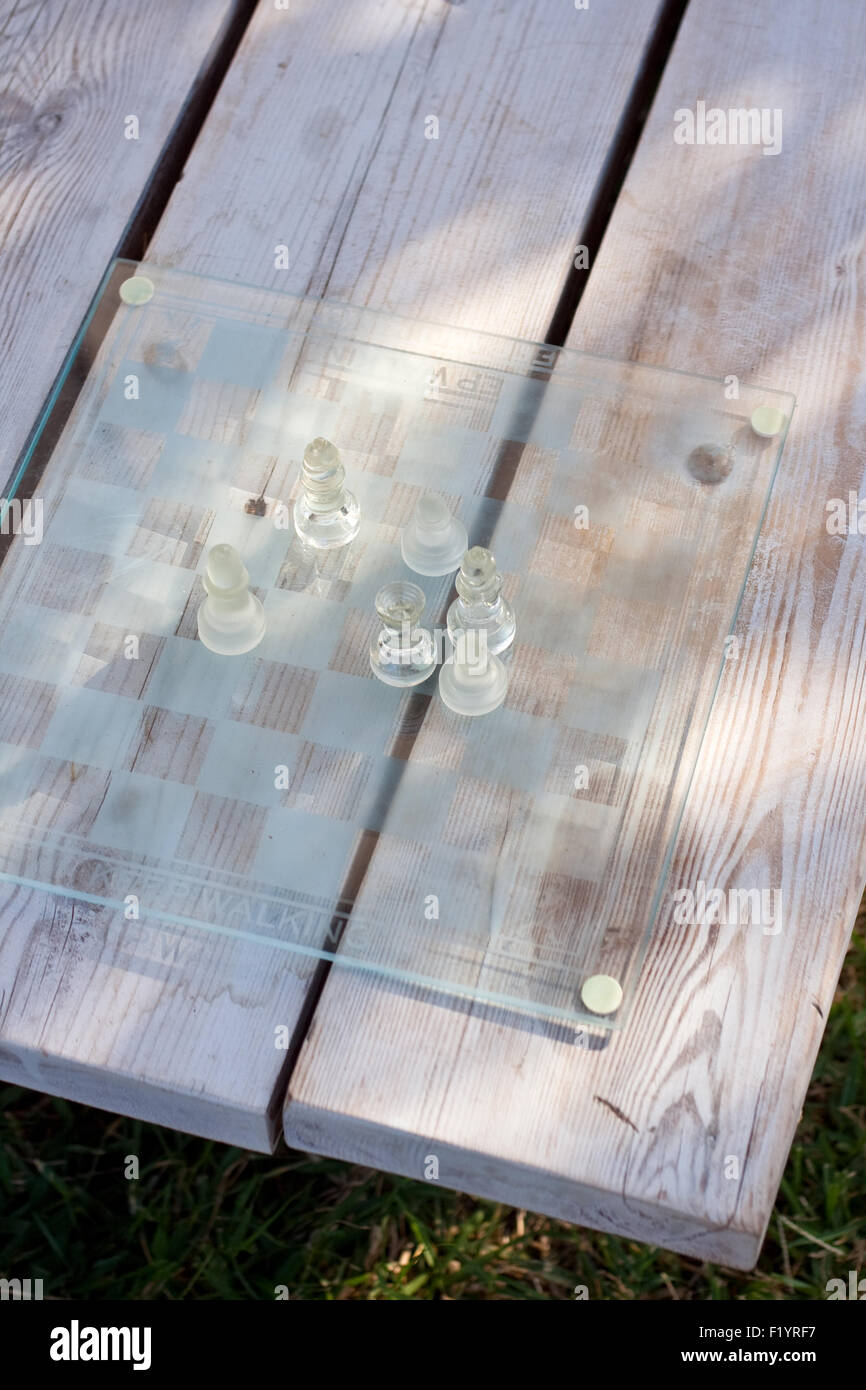 Glass chess game on the table Stock Photo