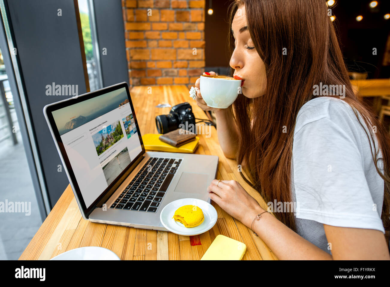 Woman working online with coffee cup Stock Photo