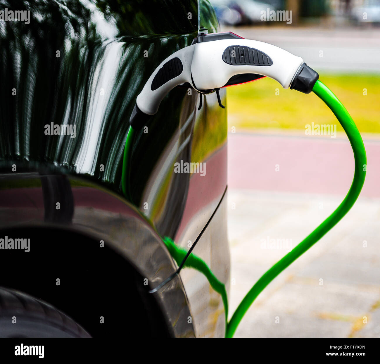 Electric car charging in EV charging station Stock Photo
