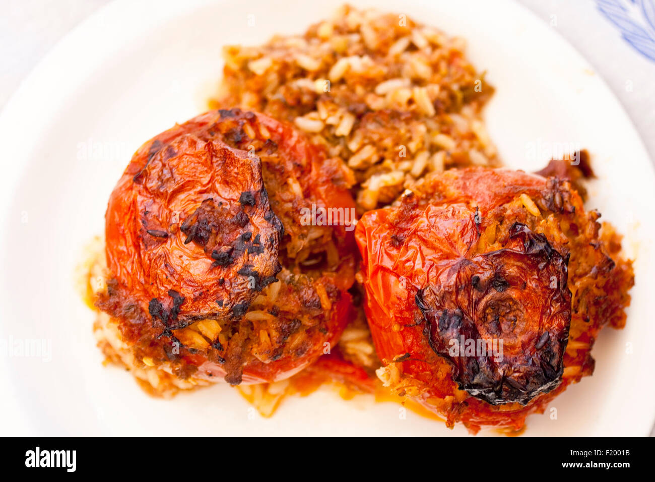 Gemista, Greek stuffed tomatoes on dish Stock Photo
