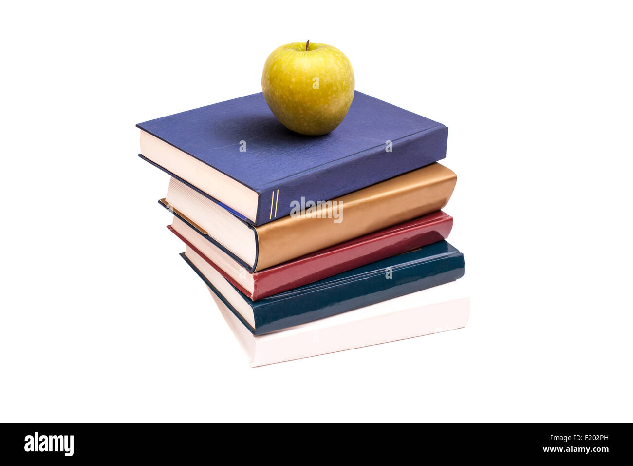 Books and green apple isolated on white background Stock Photo - Alamy