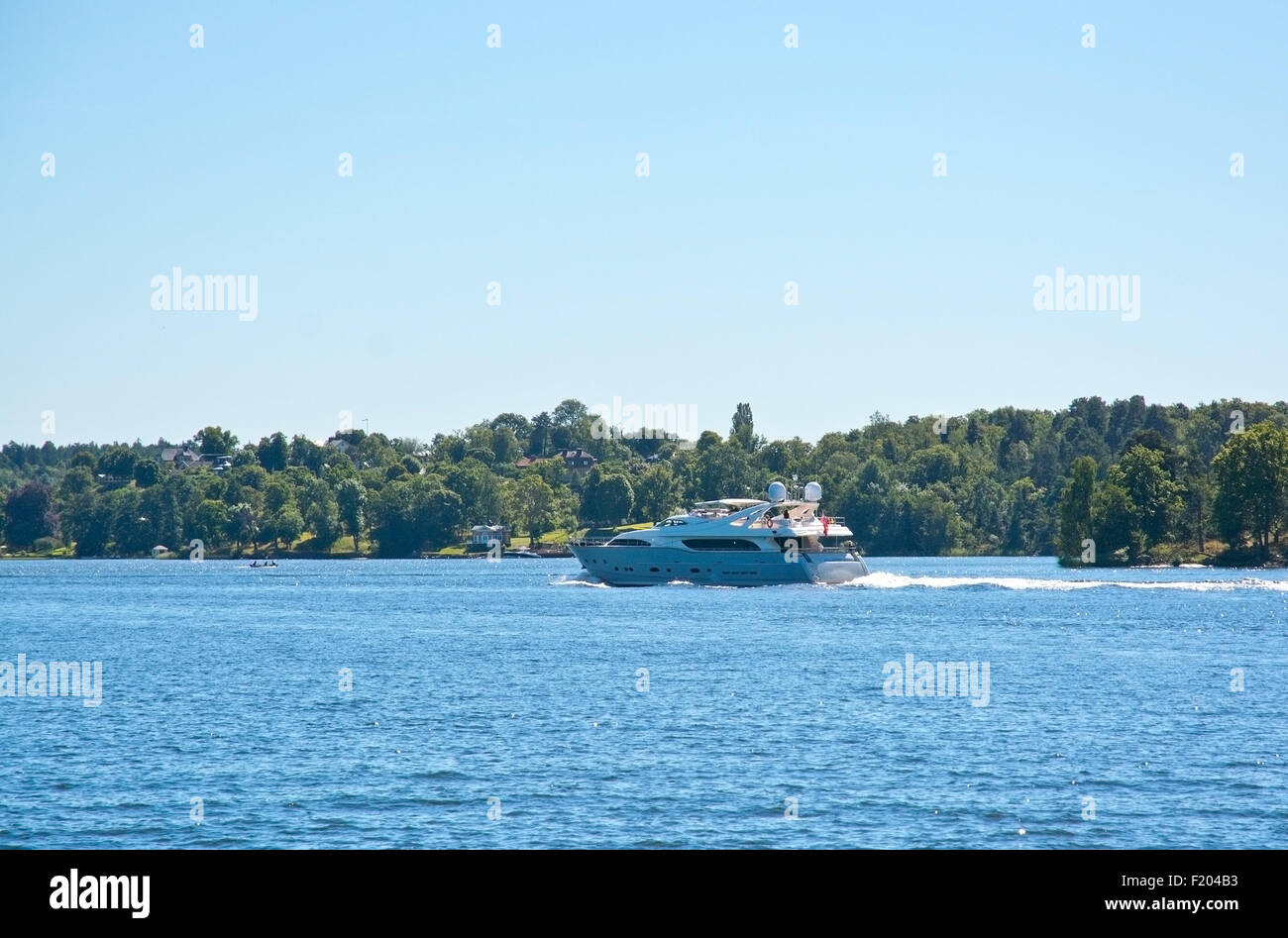 Yacht speeding on Lake Malaren on a sunny summer day on August 14, 2015 in Bromma, Stockholm, Sweden. Stock Photo